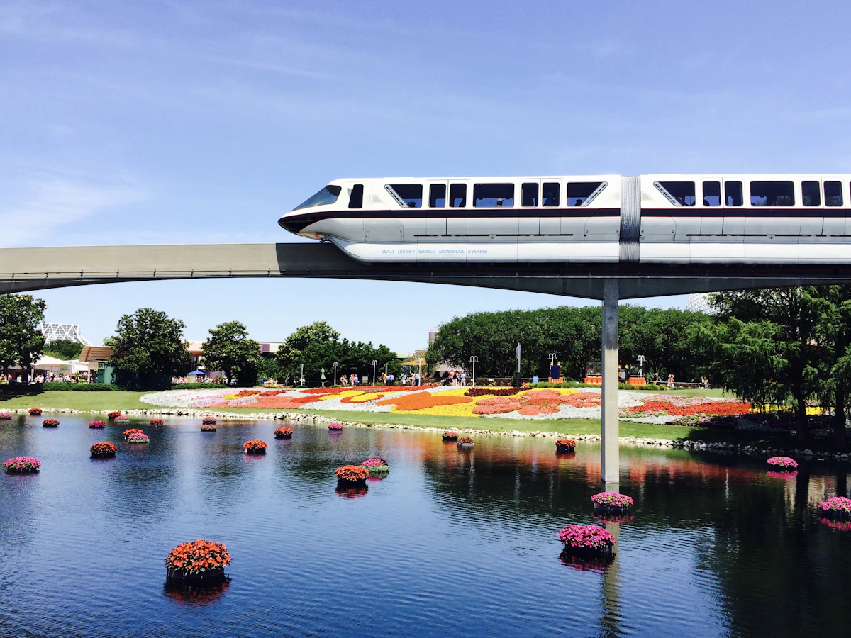 Monorail train crossing an elevated track in daylight