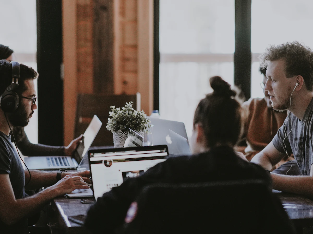 Agency team reviewing campaign work around a table
