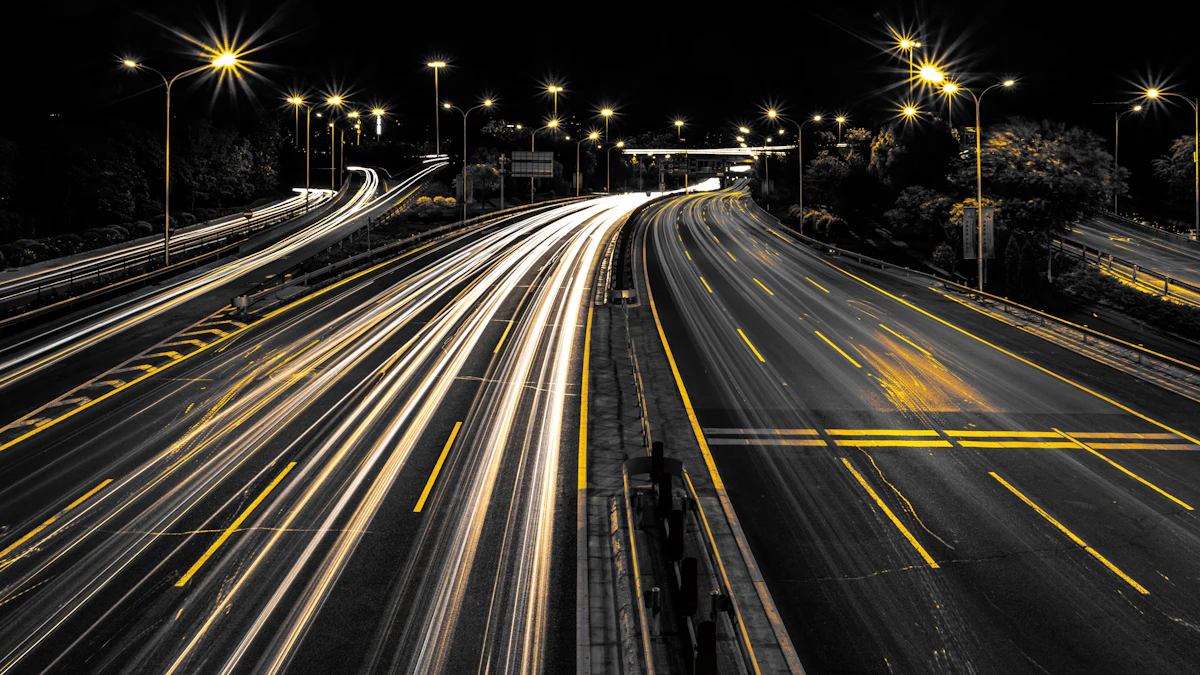 Long-exposure light trails along a night motorway